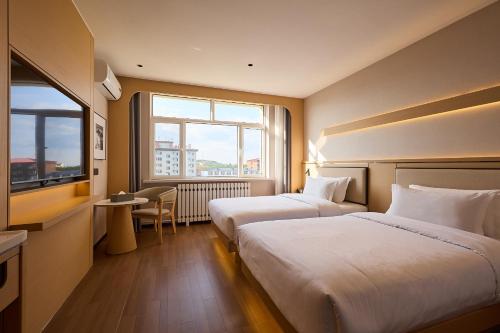 Φωτογραφία από το άλμπουμ του Suoxing Hotel Wulanbutong Scenic Area Branch σε Xiaogushan