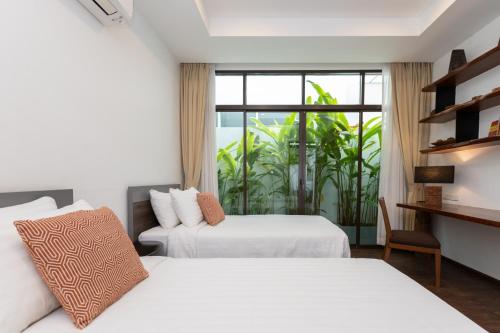 Postel nebo postele na pokoji v ubytování Tolani Le Bayburi Villas, Hua Hin - Pranburi