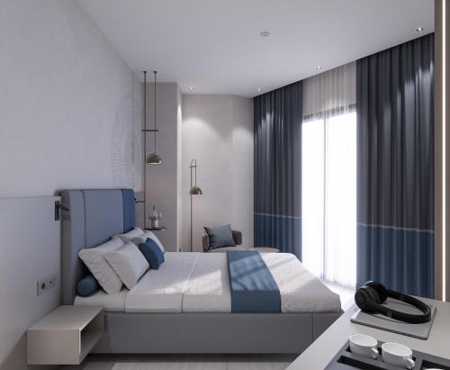 Ένα ή περισσότερα κρεβάτια σε δωμάτιο στο Echinus Blue Hotel