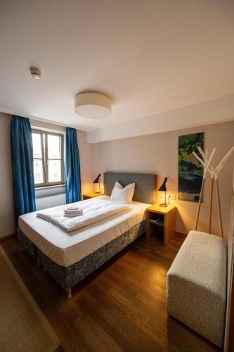 a bedroom with a large bed and a window at Vogelsburg in Volkach