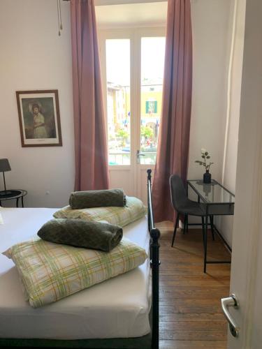 Voodi või voodid majutusasutuse Albergo Gargnano toas