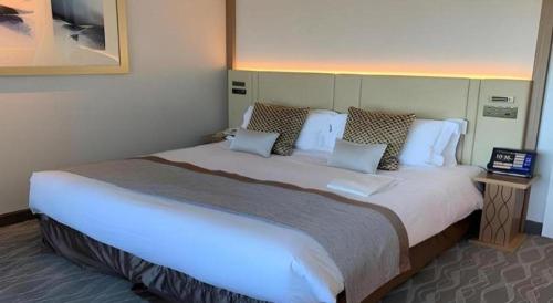 a large white bed in a hotel room at Yokohama Royal Park Hotel in Yokohama