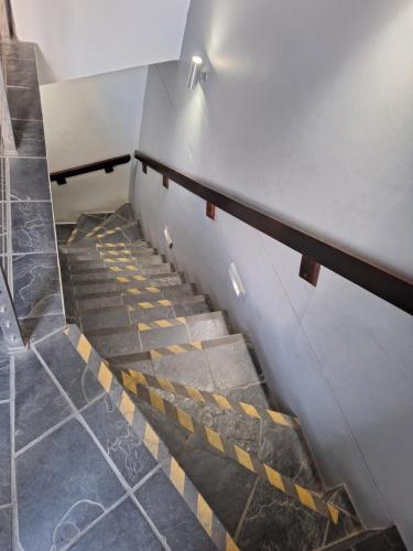a set of stairs in a building at Apartment in central Stellenbosch in Stellenbosch