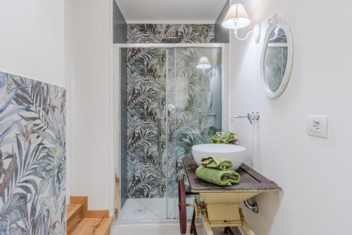 a bathroom with a sink and a shower at L'antica tipografia in Lucca in Lucca