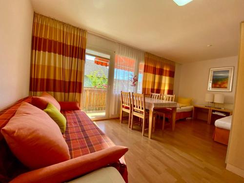 a living room with a couch and a table at Wohnung Hochbild in Überlingen