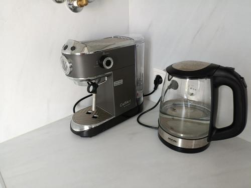 a coffee maker and a blender on a counter at New Energia apartment in center city in Narva