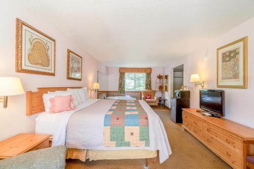 Ένα ή περισσότερα κρεβάτια σε δωμάτιο στο Hotel O Eureka Springs - Christ of Ozark Area