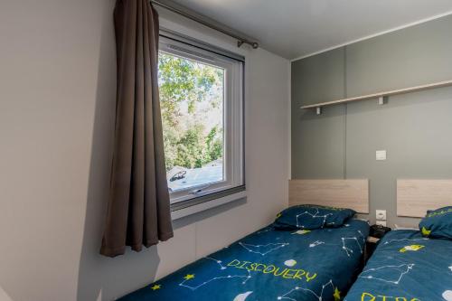 Ένα ή περισσότερα κρεβάτια σε δωμάτιο στο Mobilehome