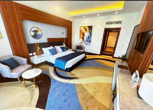 a hotel room with a bed and a living room at Tolip Resort El Galala Heights in Ain Sokhna