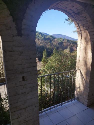 an archway in a building with a view at Le Mas Fraissinet in Saint-Jean-de-Valériscle
