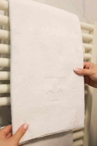 a person holding a piece of paper with a face drawn on it at Garconete in Salzburg