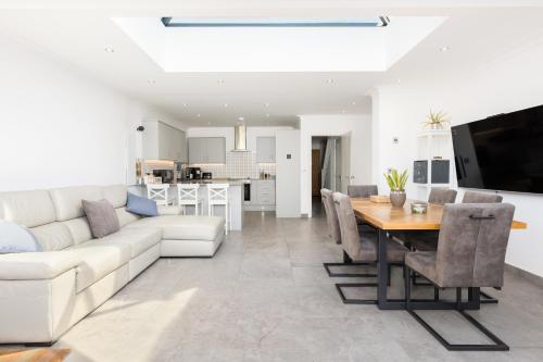 a living room with a white couch and a table at Executive Harborne House in Birmingham
