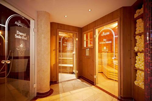 a hallway of a store with doors and windows at Alpenjuwel Jäger in Tux