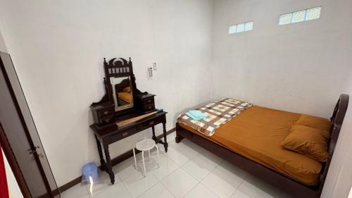 Postel nebo postele na pokoji v ubytování Dewananda Homestay