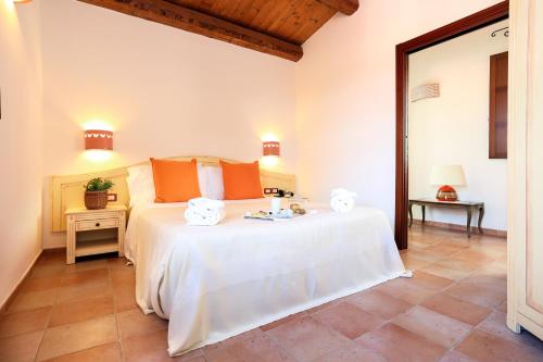 Letto o letti in una camera di Alghero Resort Country Hotel & Spa