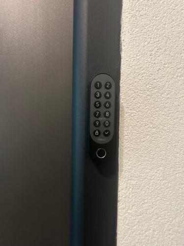 a remote control on the side of a wall at Old Town Luxe Loft in Iaşi