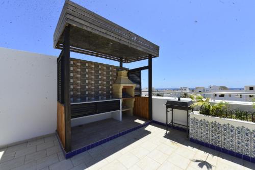 a pavilion on the roof of a building at Dar Hella Apartments in El Maamoura