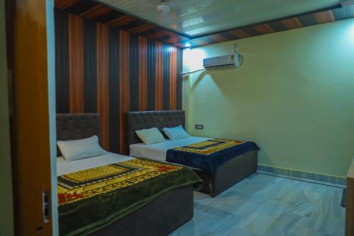 Ένα ή περισσότερα κρεβάτια σε δωμάτιο στο Heramb pg house