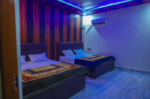 Ένα ή περισσότερα κρεβάτια σε δωμάτιο στο Heramb pg house