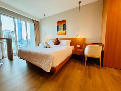 Ένα ή περισσότερα κρεβάτια σε δωμάτιο στο Ramad Serviced Suites KLCC