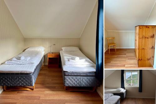 two twin beds in a small room with a table at Ballstad Tide House - Lofoten in Ballstad