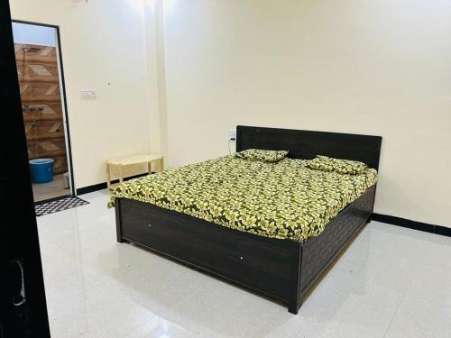 a bedroom with a bed in a room at Shree Ram Home Stay in Ujjain