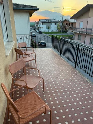 a group of chairs sitting on a balcony at Vivere Nient'Altro between port and historic center in Marano Lagunare