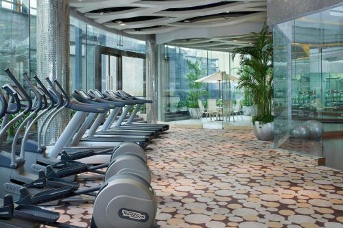 a gym with a row of treadmills in a building at Four Points By Sheraton Beijing, Haidian in Beijing