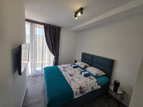 Ένα ή περισσότερα κρεβάτια σε δωμάτιο στο Villa Azzurra