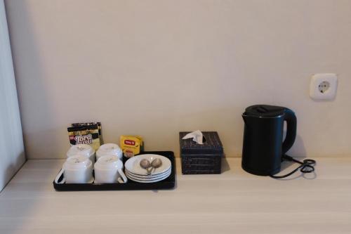 BeSt Sport Wisata Batuにあるコーヒーまたはお茶