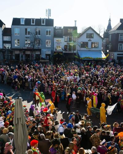 a large crowd of people standing in a street at Tower Apartment Centre Sittard in Sittard