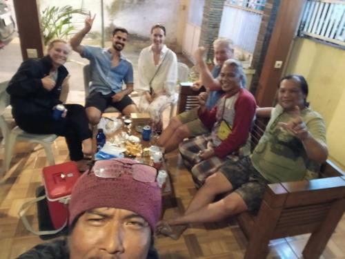 a group of people sitting in a living room at Dannu's Homestay Ijen and Bromo Tour in Banyuwangi
