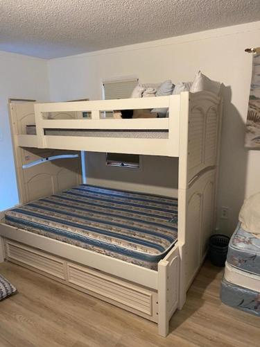 a white bunk bed in a room at Oceanside, Single Family, Private Yard, Wifi, Washer Dryer, Ocean Side Home In Beach Haven 60092, in North Beach Haven