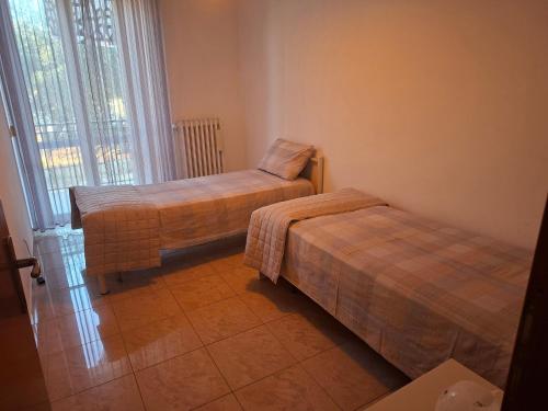 Ένα ή περισσότερα κρεβάτια σε δωμάτιο στο La CASA degli IPPOCASTANI