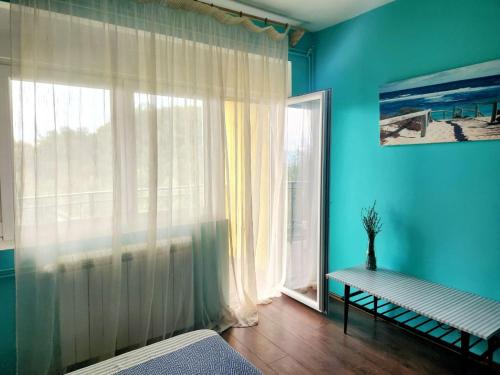Ένα ή περισσότερα κρεβάτια σε δωμάτιο στο Sunny House