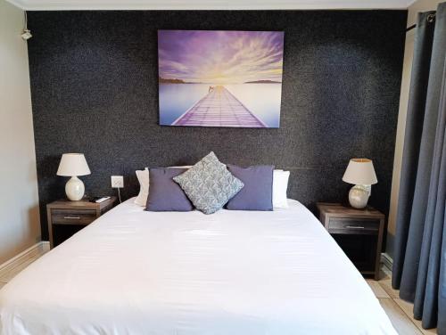 Ein Bett oder Betten in einem Zimmer der Unterkunft Reef View BnB