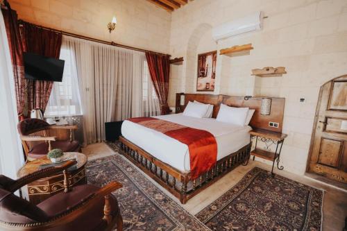 Ένα ή περισσότερα κρεβάτια σε δωμάτιο στο Tessera Hotel