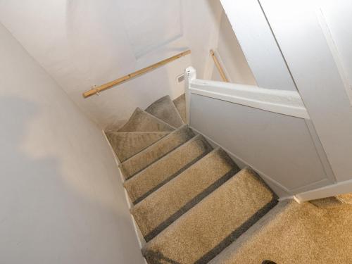 a staircase in a house with a stair case at Lowther House in Whitehaven