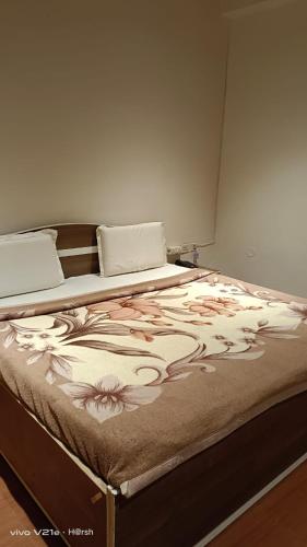 Postel nebo postele na pokoji v ubytování Hotel Om Complex