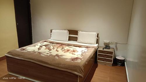 Postel nebo postele na pokoji v ubytování Hotel Om Complex