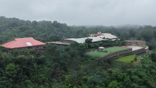 an overhead view of a bridge in the forest at Ikshana Resort and Spa, Khandala in Lonavala