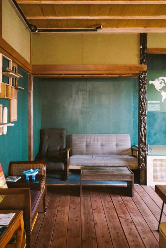 a living room with a couch and a table at guesthouse TANDEM in Matsumoto