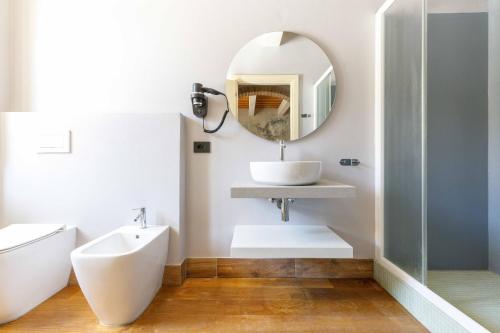 a bathroom with a sink and a mirror at Villa Roncuzzi 
