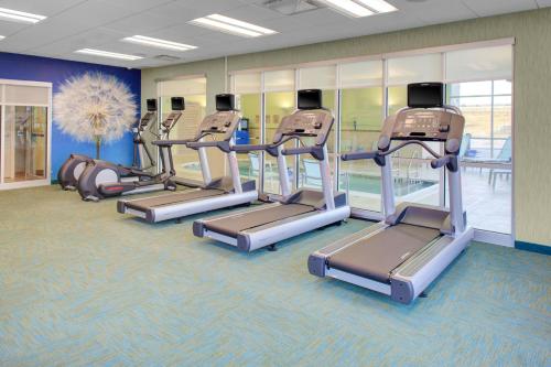 a row of treadmills in a gym at SpringHill Suites by Marriott Augusta in Augusta