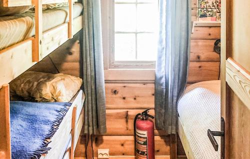 a bedroom with two bunk beds and a window at 4 Bedroom Stunning Home In Tynset in Tynset