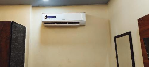 a air conditioner on a wall in a room at Hotel AL Taj , Agra in Agra