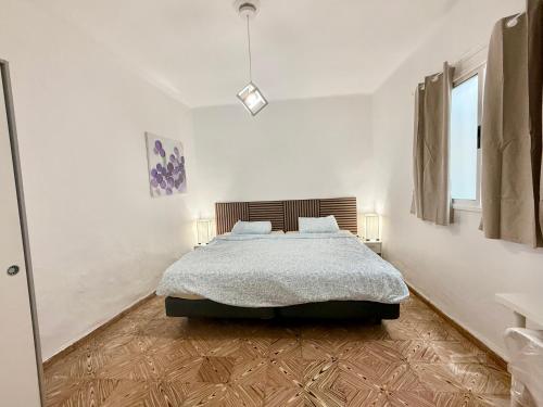 En eller flere senge i et værelse på Rooms La Laja 1
