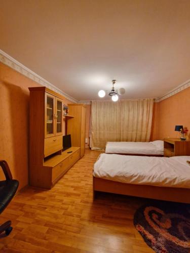 Postel nebo postele na pokoji v ubytování Casa Mioritei