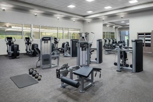 a gym with several treadmills and exercise machines at The Westin Baltimore Washington Airport - BWI in Linthicum Heights
