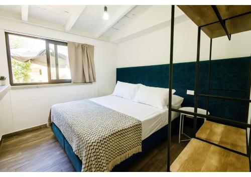 Giường trong phòng chung tại Il Sogno